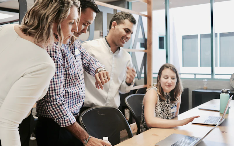 Colleagues gathered around a table during a workplace training session