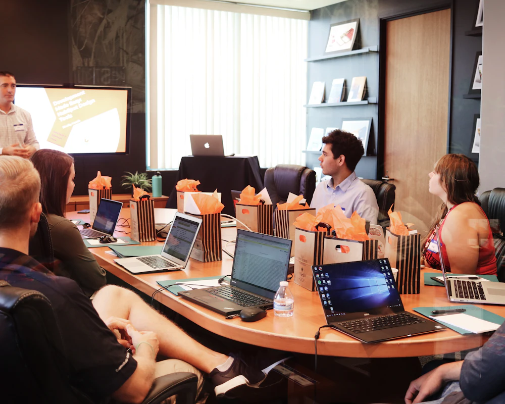 A team of professionals in a training session around a conference table